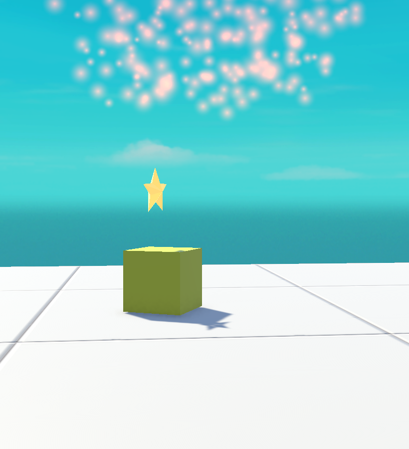 A real Unity render of a Shuriken particle burst: soft glowing orange embers rising and fading above a box, using an additive spark material.